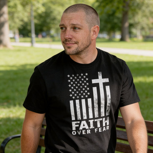 Tim wearing black Comfort Colors 1717 patriotic Christian t-shirt with American flag and cross design, featuring 'Faith Over Fear' text.