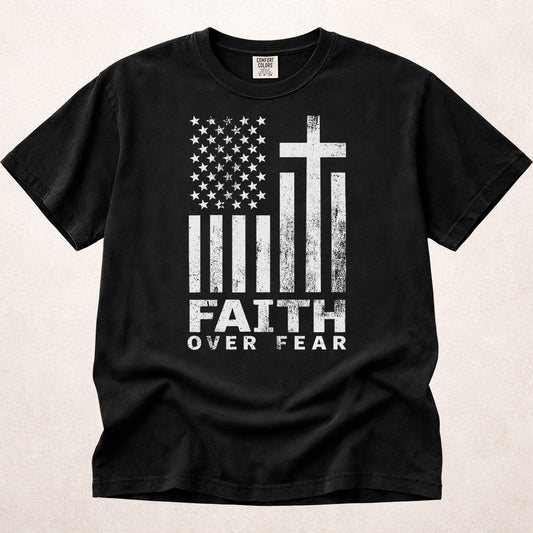 Black Comfort Colors 1717 patriotic Christian t-shirt with American flag and cross design, featuring 'Faith Over Fear' text.