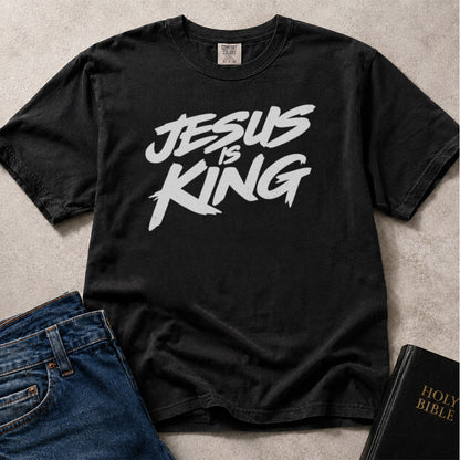 Black Comfort Colors® 1717 tee with Jesus Is King text in a streetwear graffiti style.