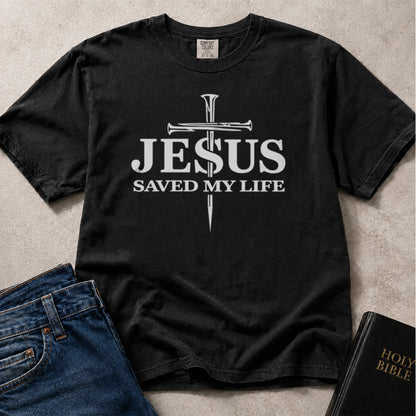 Black Comfort Colors 1717® Christian t-shirt with 'Jesus Saved My Life' text and cross design.