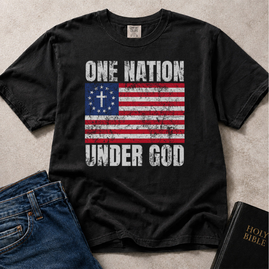 Patriotic Christian t-shirt with 'One Nation Under God' American flag graphic on a Comfort Colors 1717 tee in Black. 
