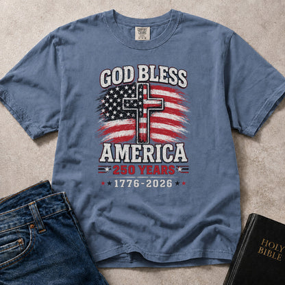 Patriotic Christian t-shirt featuring an American flag, a cross, and God Bless America - 1776 - 2026, 250 years.
