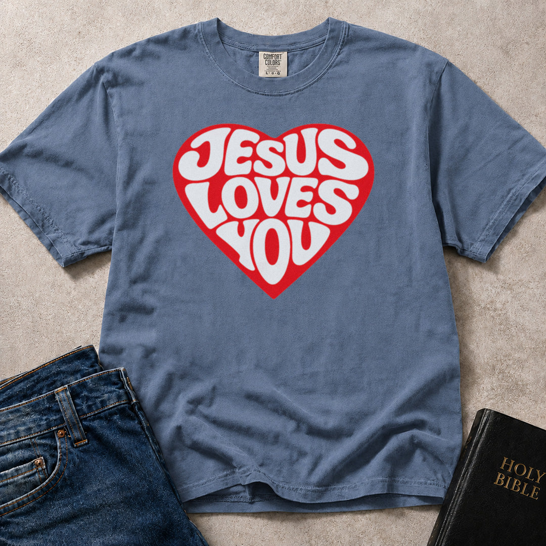 Blue (Blue Jean) Comfort Colors® 1717 t-shirt with a bold heart graphic and "Jesus Loves You" lettering in a groovy retro style.