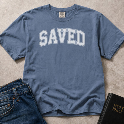 Blue (Blue Jean). Comfort Colors® 1717 unisex tee featuring faith inspired text that reads “Saved” in clean varsity lettering.