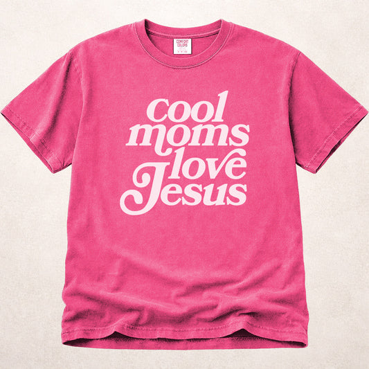 Pink (Crunchberry) Comfort Colors® 1717 women’s tee featuring uplifting Christian text that reads “Cool Moms Love Jesus” in a fun, relaxed typographic look.