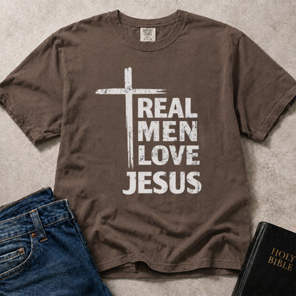 Real Men Love Jesus religious slogan with a cross design on brown (Espresso) Comfort Colors 1717® t-shirt.