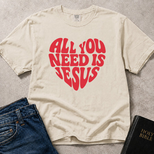 All You Need Is Jesus faith based heart graphic on off white (Ivory) Comfort Colors 1717® t-shirt.