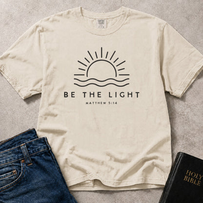 Off White (Ivory) Comfort Colors® 1717 scripture inspired tee featuring a Be the Light design drawn from Matthew 5:14.