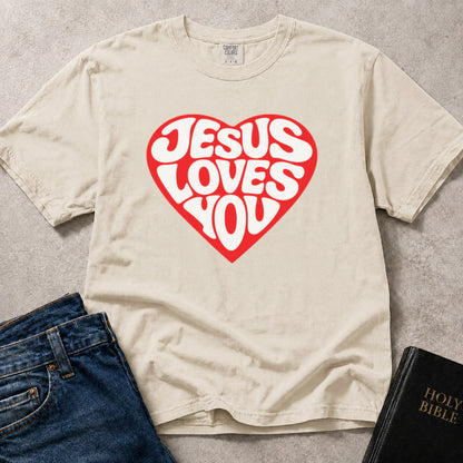 Off White (Ivory) Comfort Colors® 1717 tshirt with a bold heart graphic and "Jesus Loves You" in vintage style lettering, a scripture based design with a clean, encouraging look.