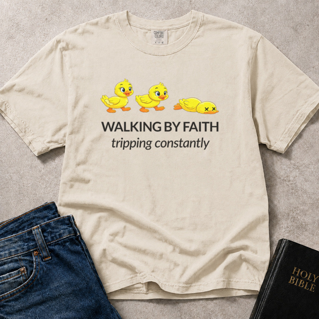 Walking by Faith Tripping Constantly funny Christian design on an off white (Ivory) Comfort Colors 1717® tee.