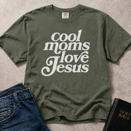 Green (Moss) Comfort Colors® 1717 women’s t-shirt with faith based lettering that reads “Cool Moms Love Jesus”.