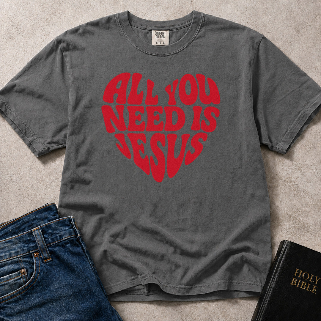 All You Need Is Jesus Christian encouragement expression heart shaped graphic on charcoal gray (Pepper) Comfort Colors 1717® tee.