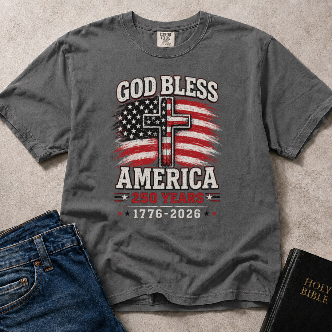 Charcoal Gray (Pepper) Comfort Colors® 1717 faith inspired tee reading God Bless America with patriotic lettering celebrating 250 years of American history.