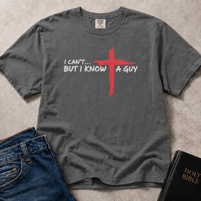 I Can't But I Know a Guy Jesus humor on faded black (Pepper) Comfort Colors 1717® t-shirt.