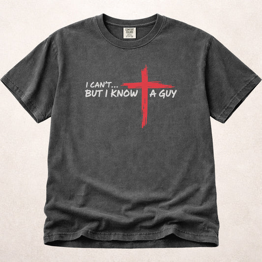 I Can't But I Know a Guy Jesus humor on faded black (Pepper) Comfort Colors 1717® t-shirt.