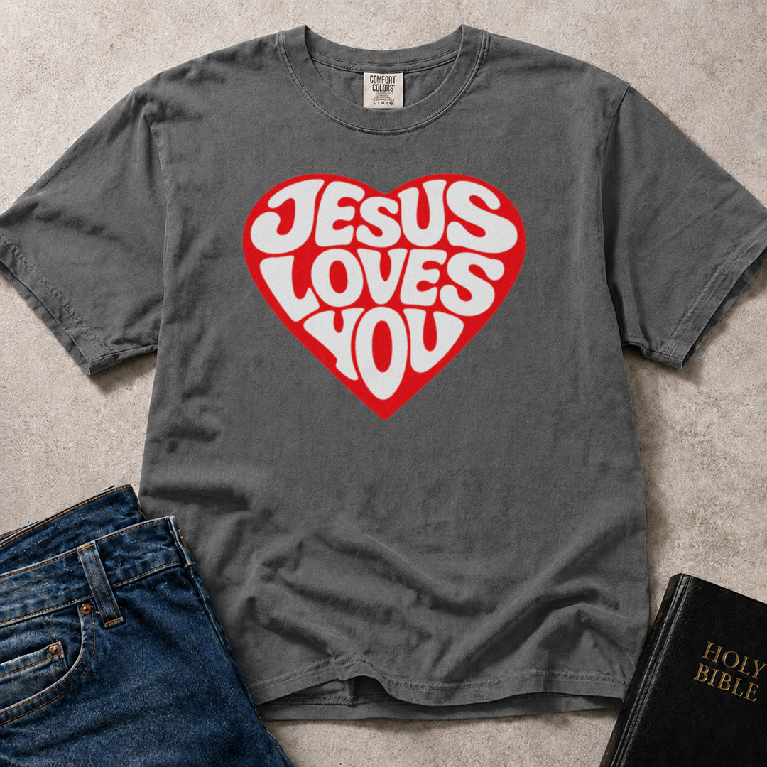 Charcoal Gray (Pepper) Comfort Colors® 1717 tshirt with a heart graphic and "Jesus Loves You" text in a retro typographic style.