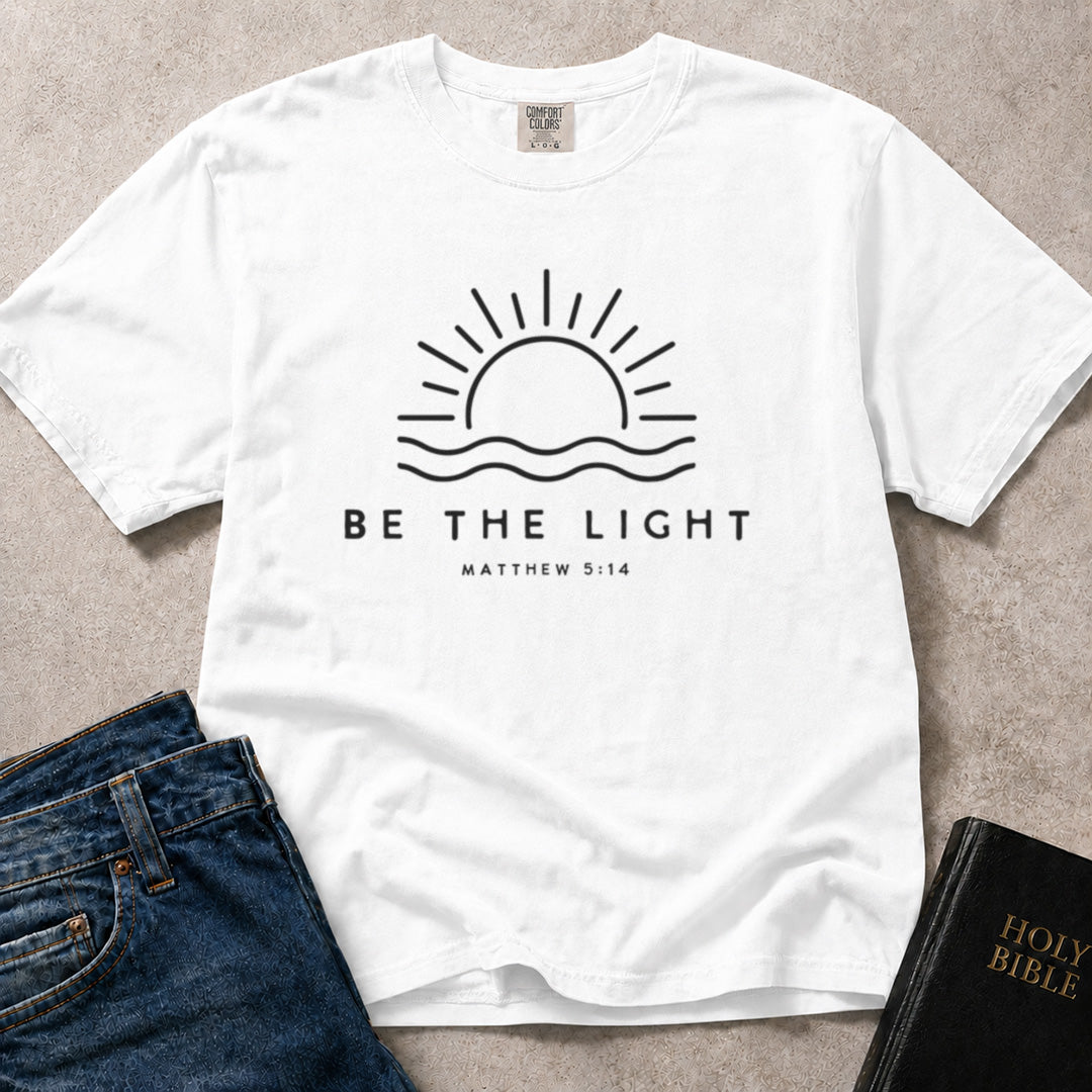 White Comfort Colors® 1717 faith inspired tee with meaningful Be the Light artwork based on Matthew 5:14 scripture.