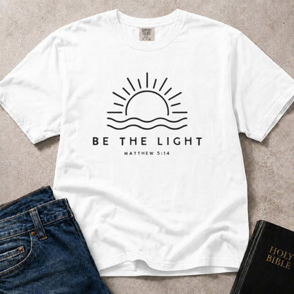 White Comfort Colors® 1717 faith inspired tee with meaningful Be the Light artwork based on Matthew 5:14 scripture.